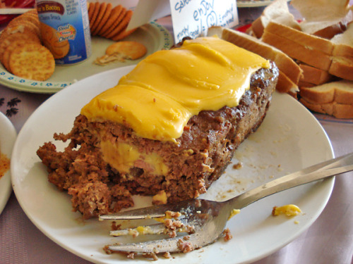 Secret Treasure Loaf A loaf of ground Spam cubes with a Velveeta cheese center topped with a layer of hot Velveeta. (via flickr)