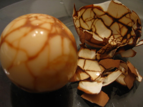 Tea Egg: Ingredients6 eggs3 tablespoons soy sauce 1 teaspoon salt1 tablespoon black tea leaves or 1 tea bag4 pieces star anise1 small stick cinnamon or cassia bark1 teaspoon cracked peppercorns (optional)2 strips dried mandarin peel (optional)Method1. Place unshelled eggs in saucepan of cold water – water level should be at least 1 inch higher than eggs. 2. Bring to a boil, then simmer for 2 minutes.3. Remove the eggs. With a knife, tap each egg to slightly crack the shells in two or three places. Return to saucepan.4. Add other ingredients and stir5. Cover and simmer for 2 hours, adding water as necessary. 6. Drain, serve hot or cold.Note:Cook longer for a stronger flavour and a deeper colour. Tea eggs are also known as Chinese marbled eggs for the unique marbling effect on the surface of the egg. Sauce can be frozen and reused.